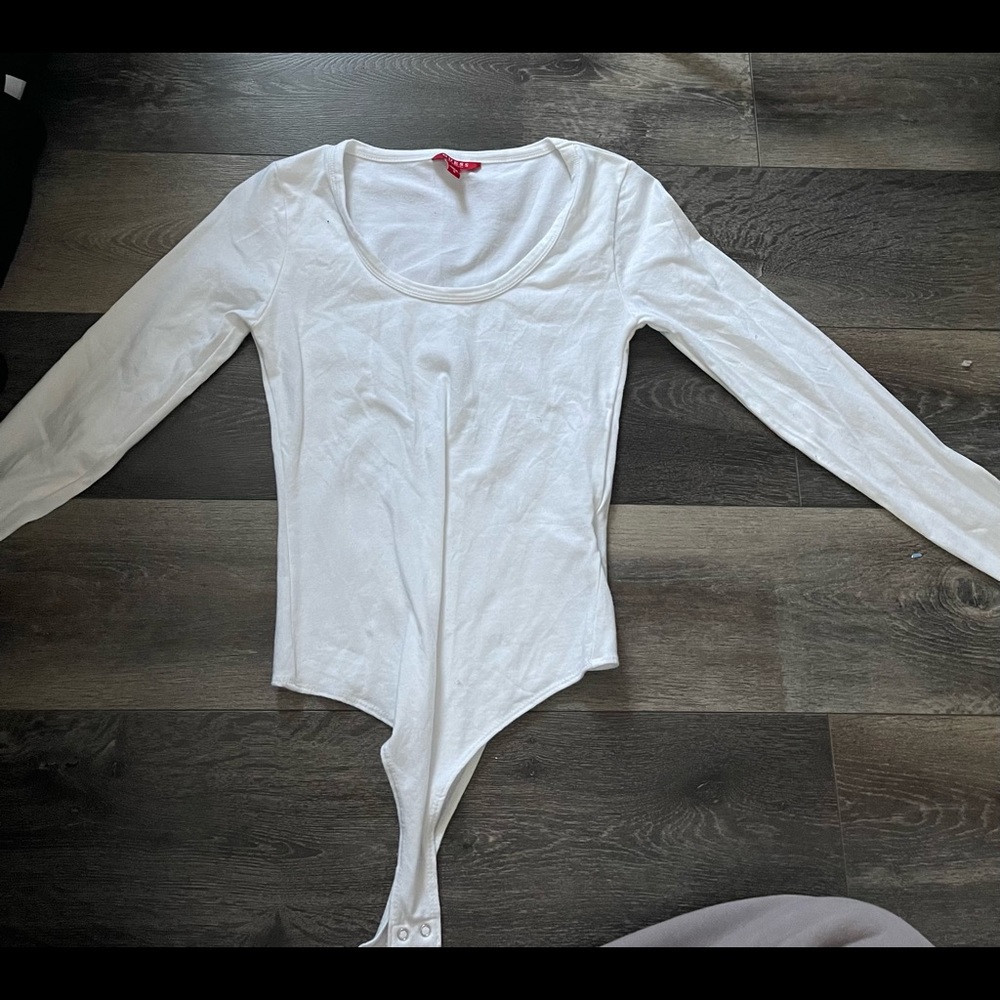 Guess white long sleeve thong body suit. Only tried on never worn